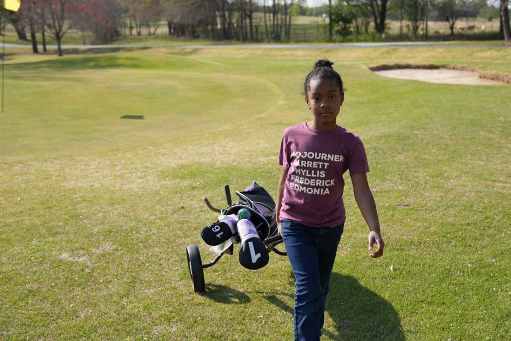 Sense of belonging - child playing golf