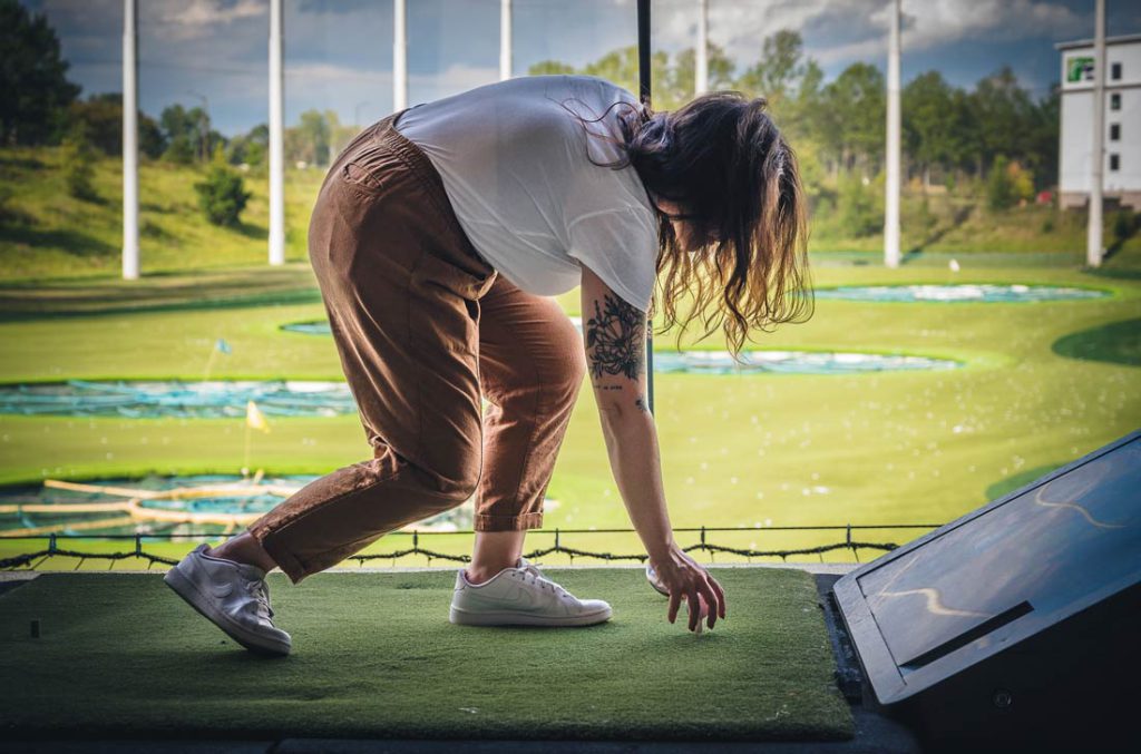 woman at golf driving range