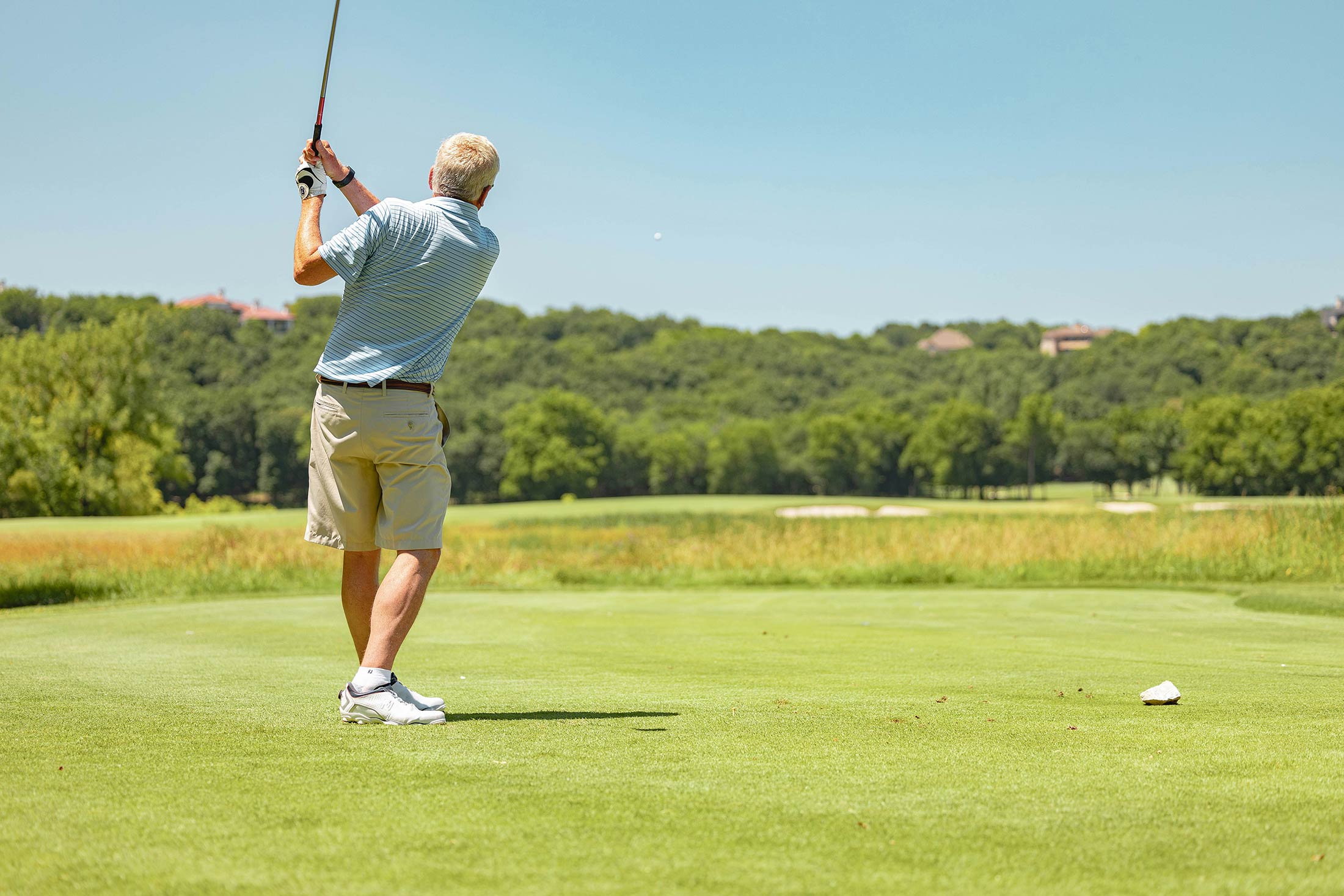 Gather Golfer hitting ball into the distance